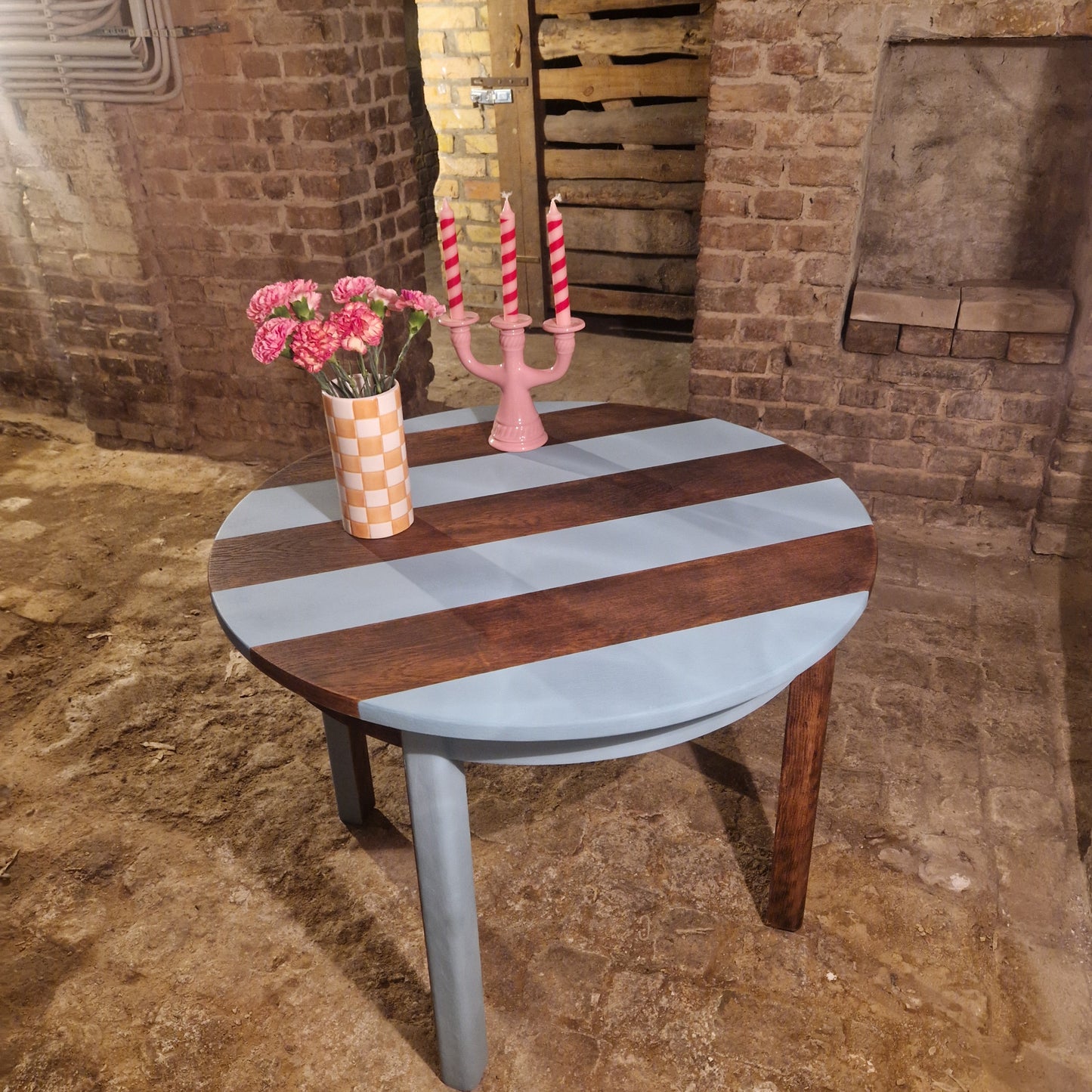 Round wooden table, striped design